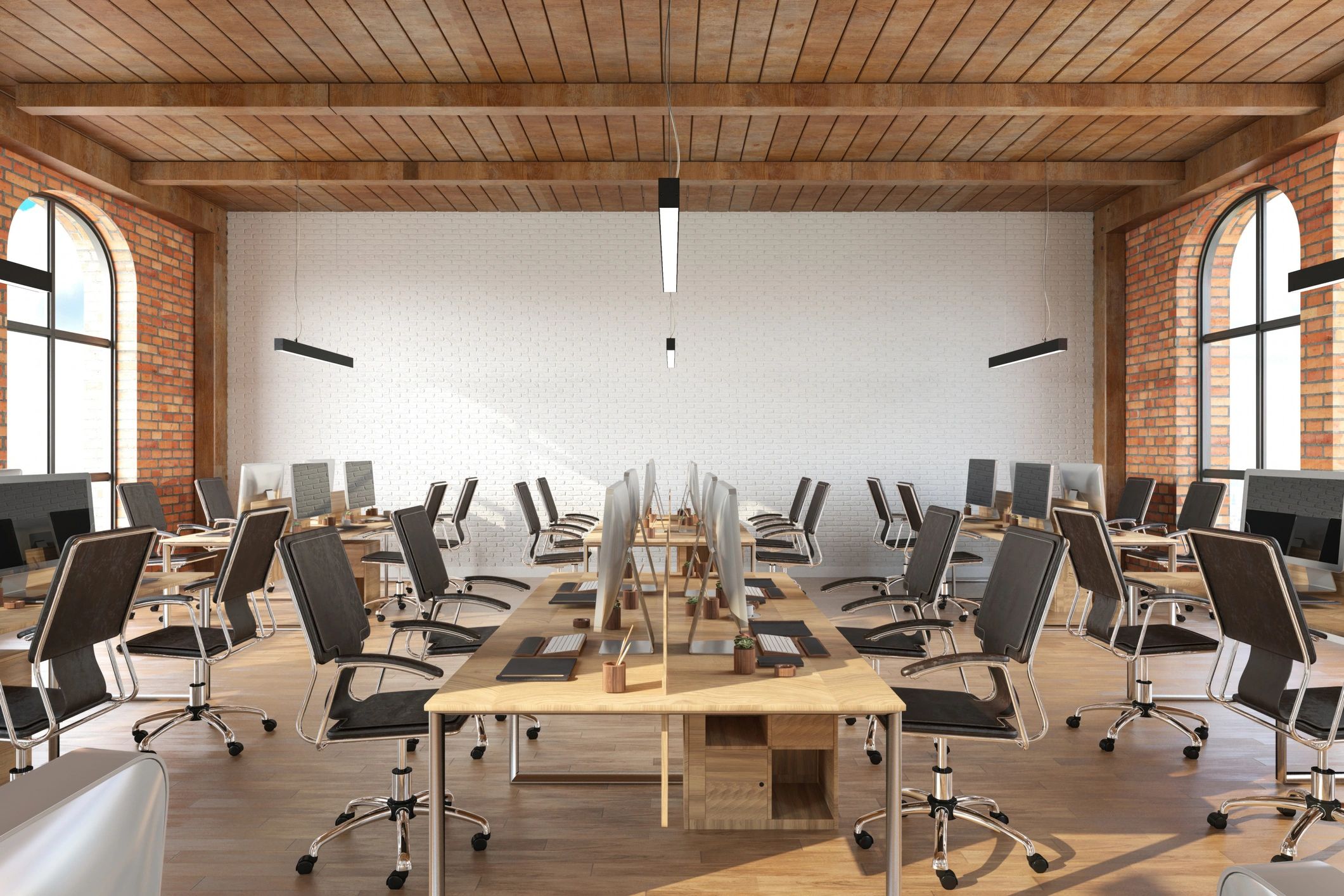 Open plan office interior with desks and modern furniture